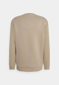 Felpa beige con maniche lunghe, polsini a coste e motivo texturizzato sulla schiena, dotata di scollatura rotonda e vestibilità rilassata.