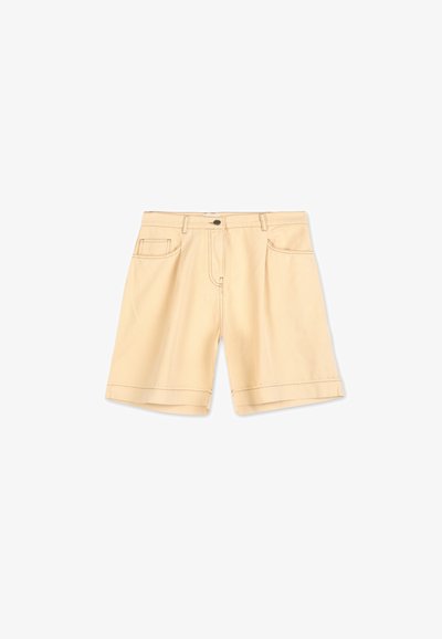 Beige cotton shorts with a straight cut, front pockets, and a button closure. Features visible stitching and a folded hem.