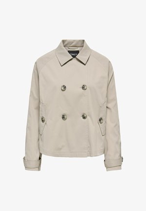 Veste beige à double boutonnage avec six boutons, deux poches latérales à rabats, manches longues et col classique.