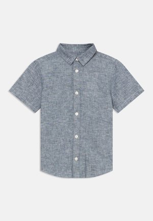 Chemise à manches courtes en tissu bleu et gris moucheté. Présente un col pointu et cinq boutons blancs sur le devant.