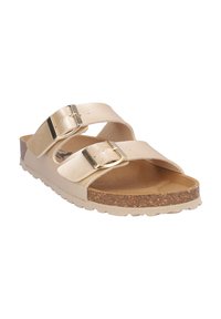 Sandalia beige con dos tiras ajustables y hebillas doradas, plantilla de corcho y suela texturizada para comodidad casual.
