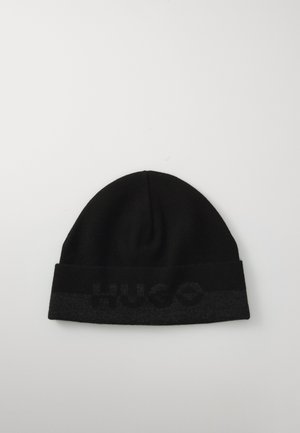 Black beanie hat with a folded cuff featuring a darker gray band and embossed "HUGO" logo. Made from soft knit fabric.
