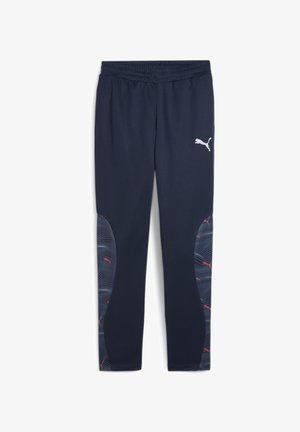 Pantaloni sportivi navy realizzati in tessuto morbido, con un elastico flessibile in vita, pannelli laterali a onda grigi e rossi, e un logo bianco.