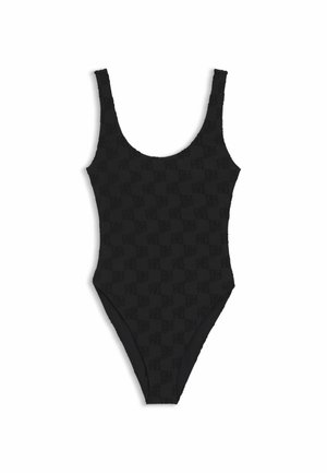 Maillot de bain une pièce noir avec larges bretelles et texture subtile à damier, présenté sur un fond blanc.