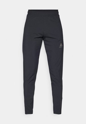 Black athletic pants made of lightweight, stretchable material. Features an elastic waistband and a logo on the left hip. Slim fit design.