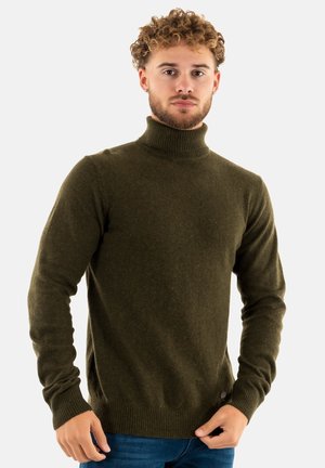 Intérieur en maille douce de couleur vert foncé, avec un col roulé, des poignets et un ourlet côtelés, et une étiquette sur le côté inférieur.