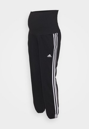 Pantalon de grossesse Adidas noir avec des bandes blanches sur les côtés et une ceinture élastique conçue pour le soutien pendant la grossesse.
