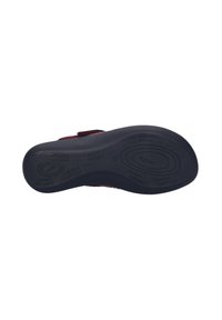 Black rubber sole with textured grip, featuring a velvety burgundy upper and adjustable strap for secure fitting.