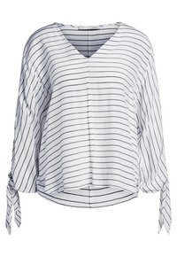 Blouse blanche à manches longues avec rayures horizontales noires, col en V, coupe ample et détail noué aux poignets.