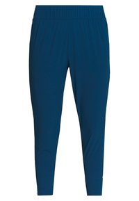 Blå, lätta sportbyxor med elastisk midja, avsmalnande ben och en slät textur. Passar för aktiv användning.