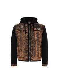 Jeansjacke mit einer verblassten braunen Vorderseite und schwarzen Ärmeln, die zwei Brusttaschen, schwarze Knöpfe und gestickte Details aufweist.