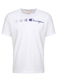 White cotton t-shirt featuring a crew neck, short sleeves, and blue and red "Champion" logo with graphic letter designs across the chest.