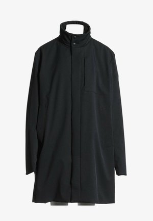Manteau long noir avec col montant fermé par deux boutons, fermeture avant dissimulée et manches longues, présenté sur un fond blanc uni.