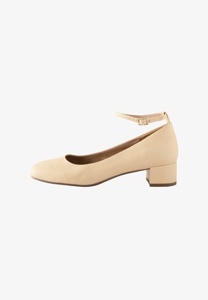 Beige textured ballet flats with a rounded toe, low block heel, and a thin ankle strap featuring a metal buckle detail.