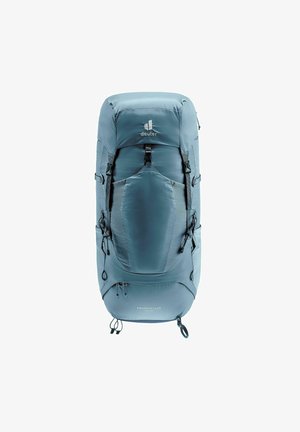 Light blue hiking backpack with a streamlined design, featuring adjustable straps, mesh accents, and a buckle closure. Textured fabric, logo visible.