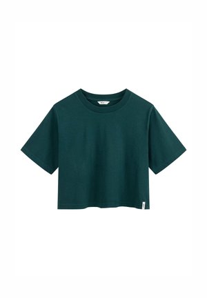 Dark green cropped short-sleeve cotton t-shirt with crew neck and small white brand tag on bottom hem.