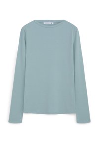 Camicia a maniche lunghe di colore azzurro chiaro, realizzata in tessuto morbido, con scollatura tonda e vestibilità comoda. Nessun motivo o dettaglio hardware visibile.