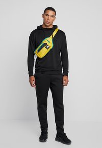 Urban Classics CUT AND SEW PANTS - Jogginghose - black