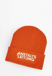 Orange knit beanie with a cuffed design. Features a rectangular white patch displaying "ANSTALTSLEITUNG" in bold lettering.
