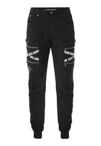 Schwarze Cargo-Hosen mit mehreren Reißverschlusstaschen, elastischen Bündchen und weißem Textbranding auf der Vorderseite. Hergestellt aus strapazierfähigem Stoff mit glatter Oberfläche.