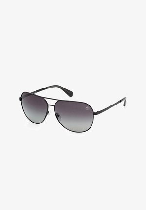 Gafas de sol tipo aviador con montura de metal negra, lentes en degradado gris y almohadillas nasales ajustables. Diseño aerodinámico con patillas finas.