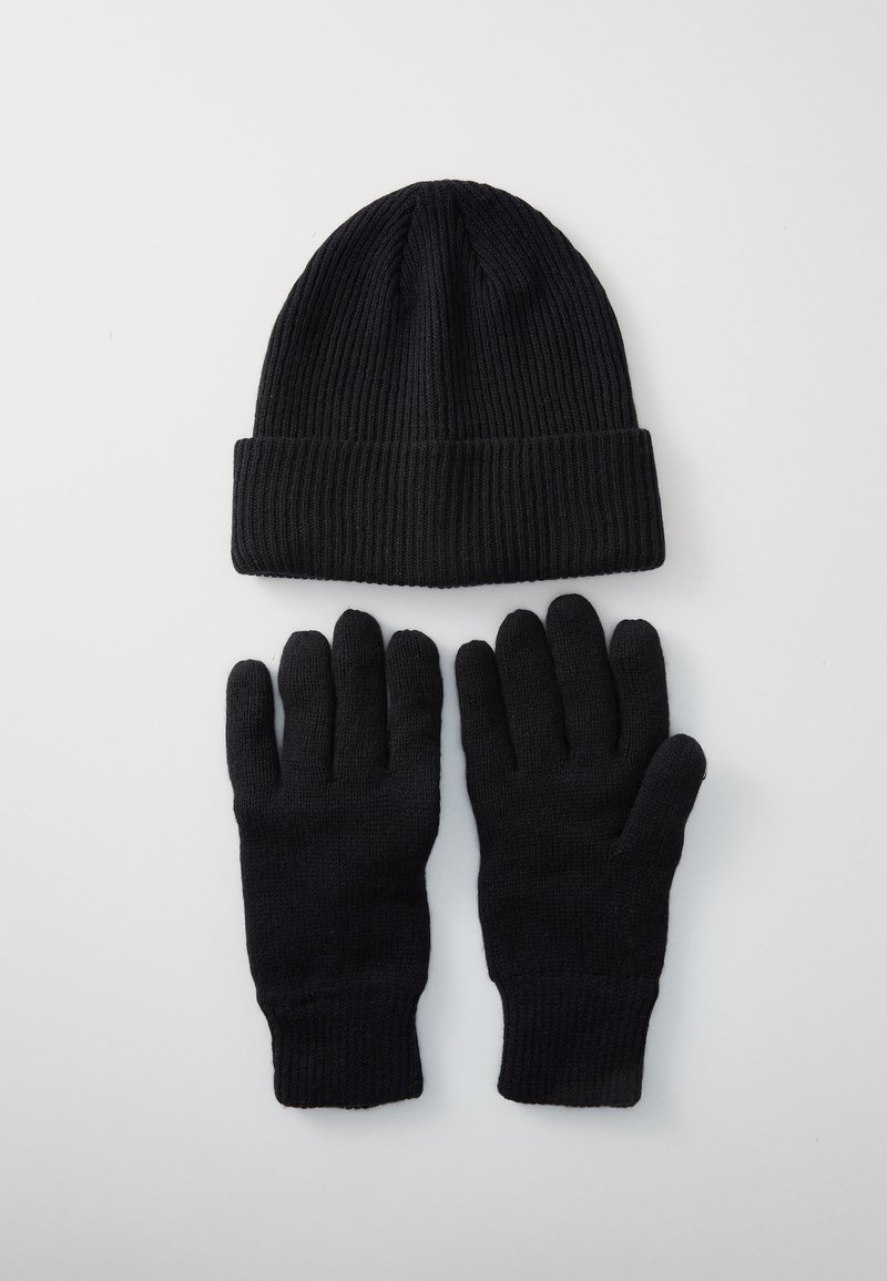 Black ribbed knit beanie hat paired with matching black knit gloves on a plain light background.