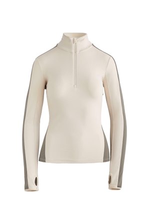 Top a maniche lunghe con collo con zip in beige chiaro e pannelli laterali grigi. Realizzato in materiale liscio ed elastico, con fori per il pollice nelle maniche.