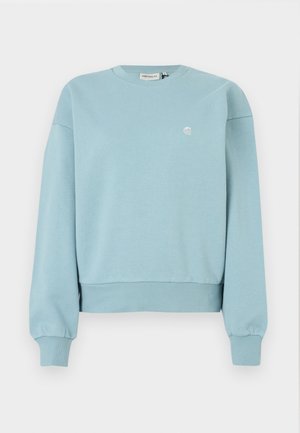 Light blue sweatshirt, made of soft cotton material. Features a crew neck, dropped shoulders, ribbed cuffs, and a small logo on the chest.