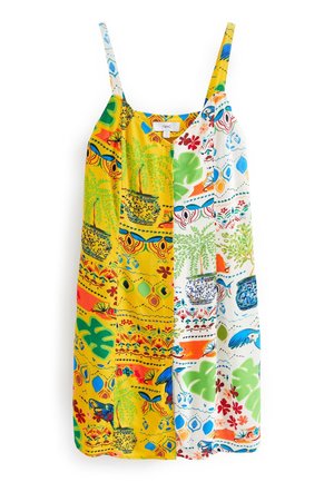 Sleeveless midi dress with thin straps, featuring a split tropical print in yellow and white with potted plants, leaves, and colorful patterns.