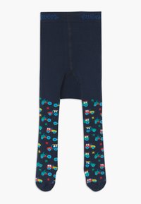Navy cotton tights with a solid color waist. Lower legs feature colorful tractor and star patterns on a dark background.