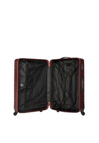 Valigia rigida color bordeaux con superficie texture, doppi scomparti, fodera interna nera e maniglia retrattile con ruote.