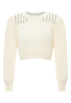 Maglione corto color crema con texture a coste, maniche lunghe e borchie decorative lungo le spalle per un tocco di stile.