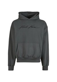 Sudadera gris hecha de tela suave, con bolsillo tipo canguro, puños y dobladillo acanalados, y con el logo negro "Karl Kani" en la parte frontal.