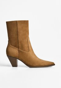 Tan suede ankle boot with a pointed toe, moderate block heel, and seamless side panels. Smooth texture, minimalist design.