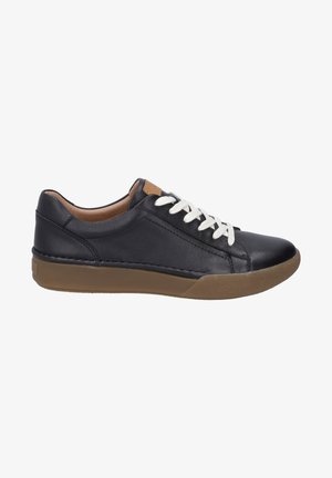 Black leather sneaker with white laces and a tan accent on the heel. Features a rubber gum sole and smooth texture. Low-top design.