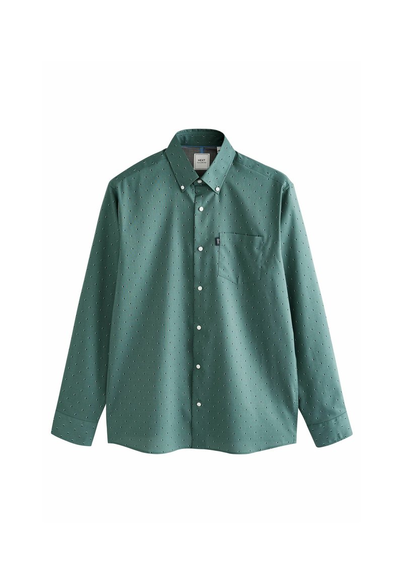 Camisa verde de botones con mangas largas, patrón de puntos blancos, bolsillo en el pecho y collar clásico. Hecha de una tela tejida con una textura suave.