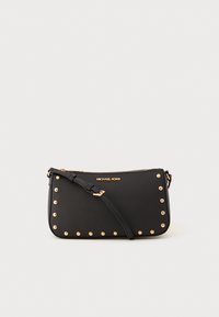 Black leather crossbody bag featuring gold-tone studs along the edges, a zip closure, and a detachable strap. Logo displayed on the front.