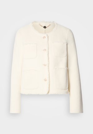White wool jacket with a cropped design, four front pockets, round neckline, and frayed edges. Features five decorative buttons.