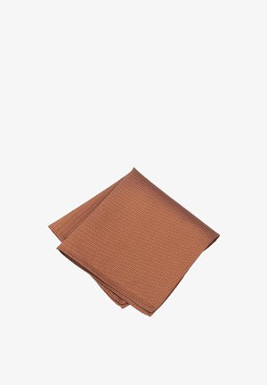 Textured fabric napkin in rust color, featuring a geometric pattern with fine accents. Folded neatly, showcasing the design and material.