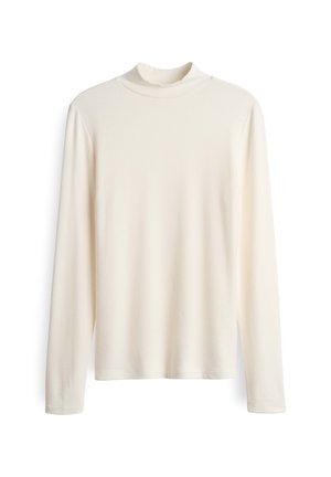 Haut crème à manches longues avec un col haut. Texture lisse et design simple. Pas de motifs ni d'embellissements visibles.