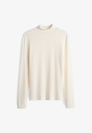 Kremowa bluzka z długimi rękawami i wysokim kołnierzem. Gładka tekstura i prosty fason. Brak widocznych wzorów lub ozdób.