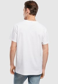 Merchcode MICKEY MOUSE M FACE - T-shirts med print - white