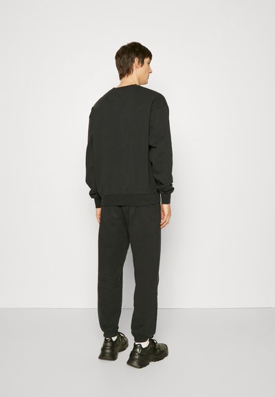 7 DAYS Active PANTS UNISEX - Spodnji deli trenirk - black