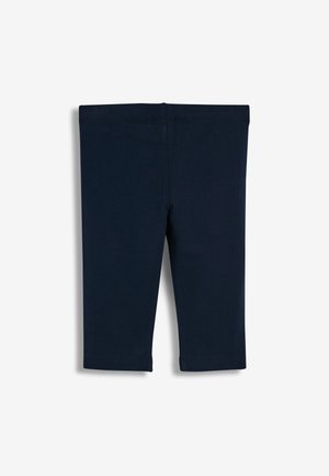 Leggings en coton bleu marine avec une texture lisse, dotés d'une taille élastique et d'une coupe à mi-genoux. Sans coutures ni motifs visibles.