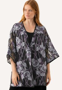 Průhledný černý kimono s fialovým a stříbrným květinovým vzorem. Kimonové rukávy do poloviny délky a otevřený přední design. Texturovaná tkanina dodává hloubku.