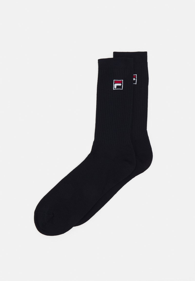 Meias caneladas pretas de cano curto com um pequeno logótipo vermelho, branco e azul na lateral. Feitas de material elástico para conforto.