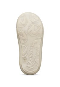 Sohle eines cremefarbenen Schuhs mit strukturierten, kreisförmigen Mustern und dem eingeprägten "Naturino"-Logo, Größe 20 nahe der Ferse markiert.