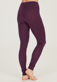 Lila leggings med en mjuk textur, hög midja och figurnära design, med avsmalnande muddar vid vristerna.