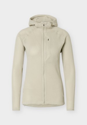 Giacca beige con cappuccio in maglia a nido d'ape a maniche lunghe, con cerniera frontale e tasca sul petto con cerniera, progettata per una silhouette aderente.