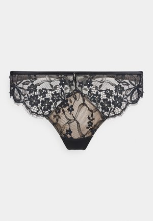 Braguitas de mujer de encaje negro con motivos florales y bordes festoneados sobre un fondo claro.